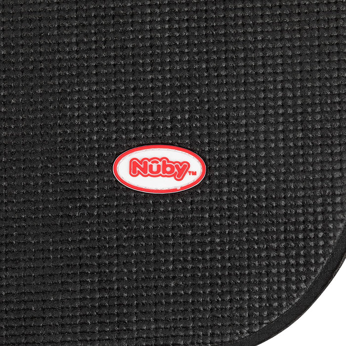 Close-up of the textured black Car Seat Undermat with a small oval red and white Nuby logo in the center, designed as an anti-slip car seat protector.