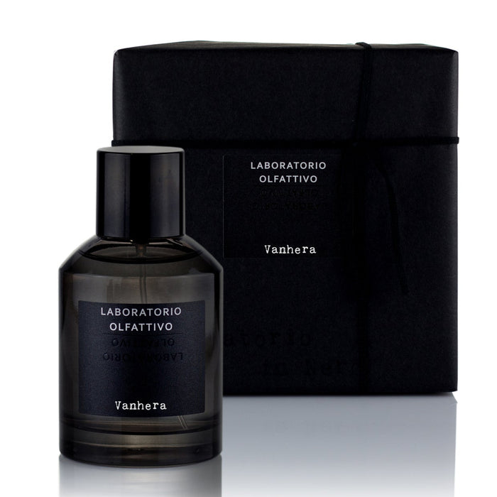 A black bottle of Vanhera 100ml Eau de Parfum with a dark vanilla fragrance, accompanied by its black packaging box with the brand name and product title visible.