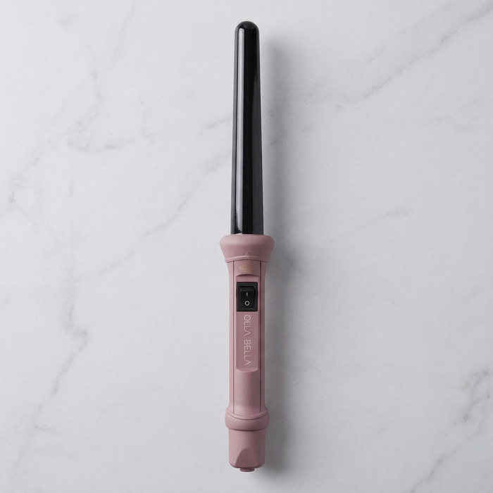 Olla Bella 1" Ceramic Curling Wand in Ballet Pink on marble countertop