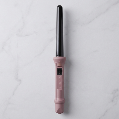 Olla Bella 1" Ceramic Curling Wand in Ballet Pink on marble countertop