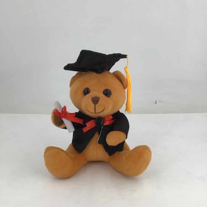 Graduation-themed teddy bear with a cap and diploma on a white background