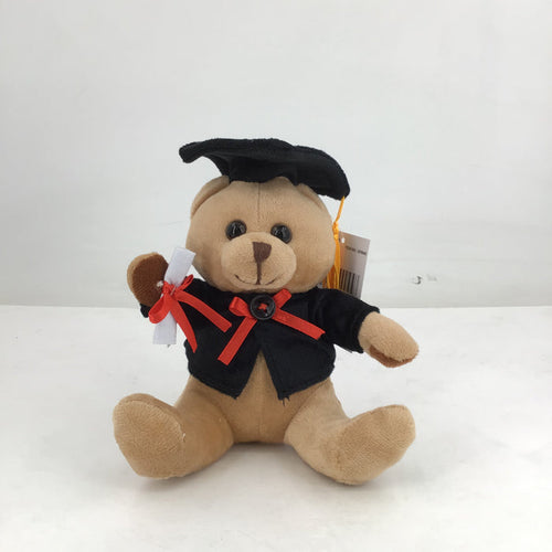 Plush teddy bear in graduation attire with a cap and gown on a white background