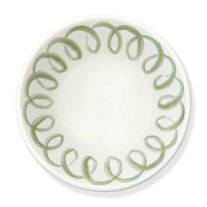A white ceramic plate with a decorative border of hand-painted olive green spiral patterns, shown from a top-down view on a white background.