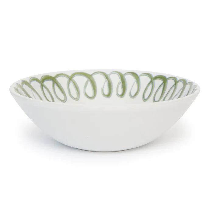 A white ceramic bowl featuring a green spiral pattern along the inner rim, set against a plain white background.