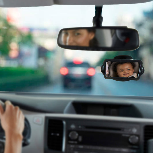 A multiangle view shows a driver’s hand on the wheel, a baby in a rear-facing car seat reflected in the Baby View Mirror, and the driver’s face visible in the rearview mirror.