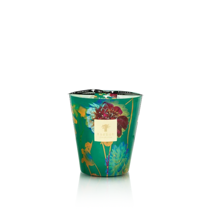 Decorative candle in a green container with floral design on a white background