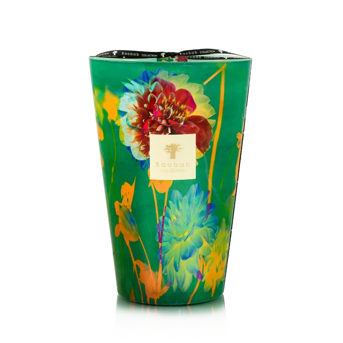 Colorful floral-patterned candle in a green container on a white background