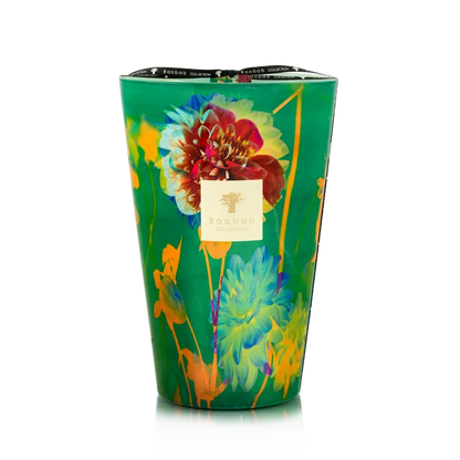 Colorful floral-patterned candle in a green container on a white background