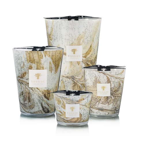 Set of four hand blown glass candles on a white background