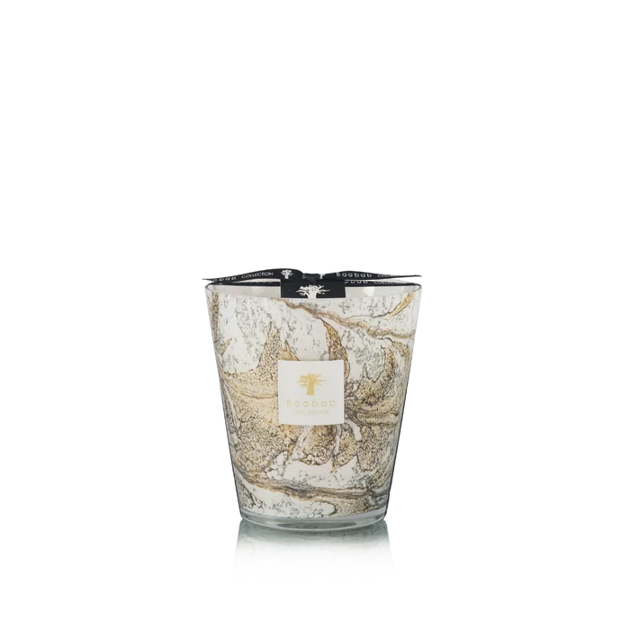 Candle in hand blown glass on a white background