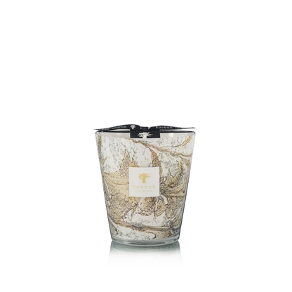 Candle in hand blown glass on a white background