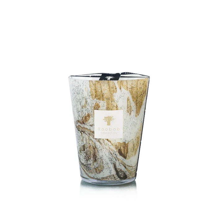 Candle in hand blown glass on a white background
