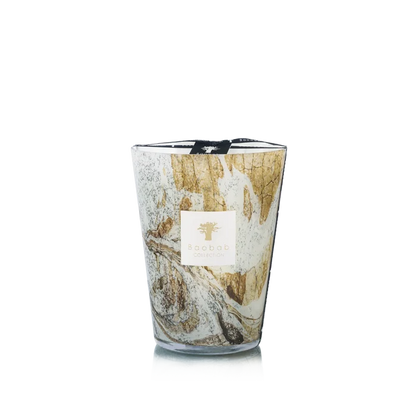 Candle in hand blown glass on a white background