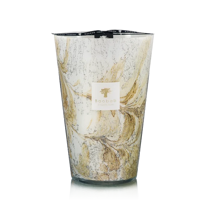 Hand blown glass candle with a visible brand label on a white background