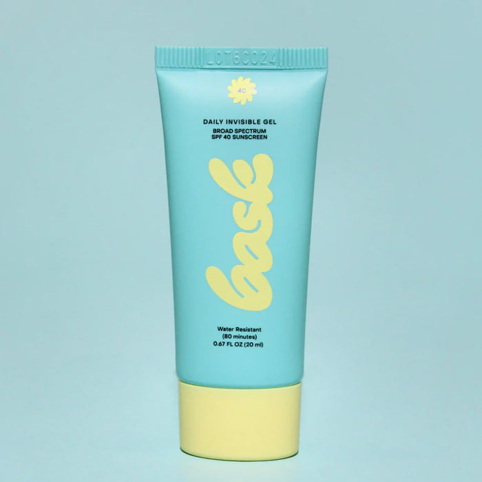 A Bask SPF 40 Face Sunscreen tube on a blue background.