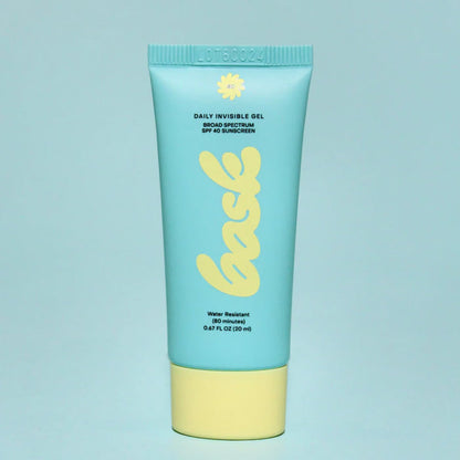 A Bask SPF 40 Face Sunscreen tube on a blue background.