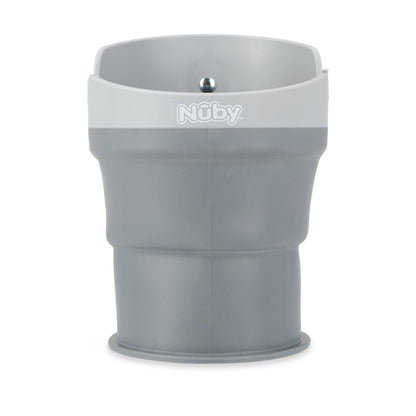 The Collapsible Stroller Cup Holder is a gray silicone cup holder with a white rim and the Nuby logo, featuring a wide opening and flexible, compact design—ideal for holding snacks on the go.