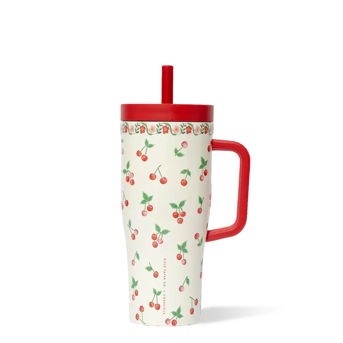Tumbler with cherry pattern and red handle on a white background