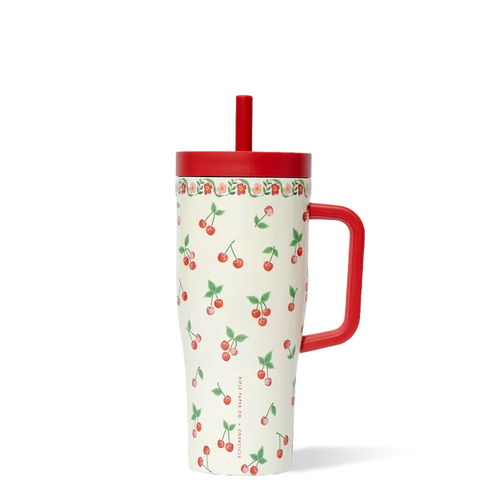 Tumbler with cherry pattern and red handle on a white background
