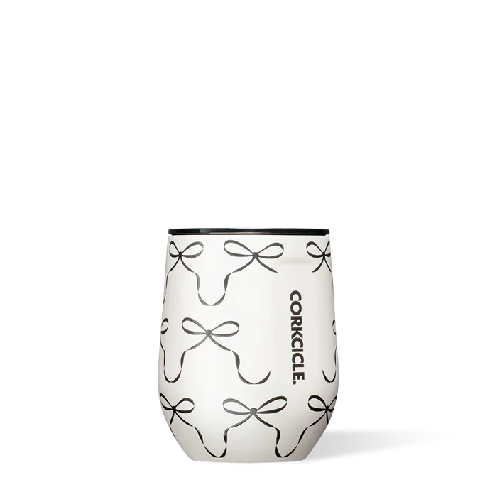 Stemless wine glass with bow pattern and Corkcicle logo on a white background