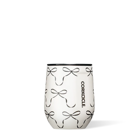 Stemless wine glass with bow pattern and Corkcicle logo on a white background