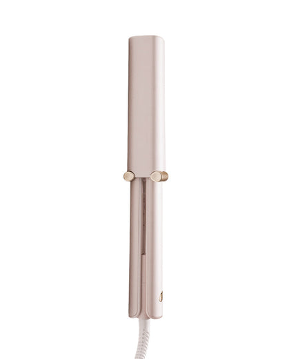 Light pink hair straightener on a white background