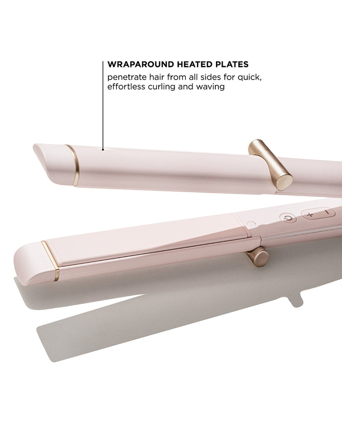 Pink hair straightener with wraparound heated plates on a white background
