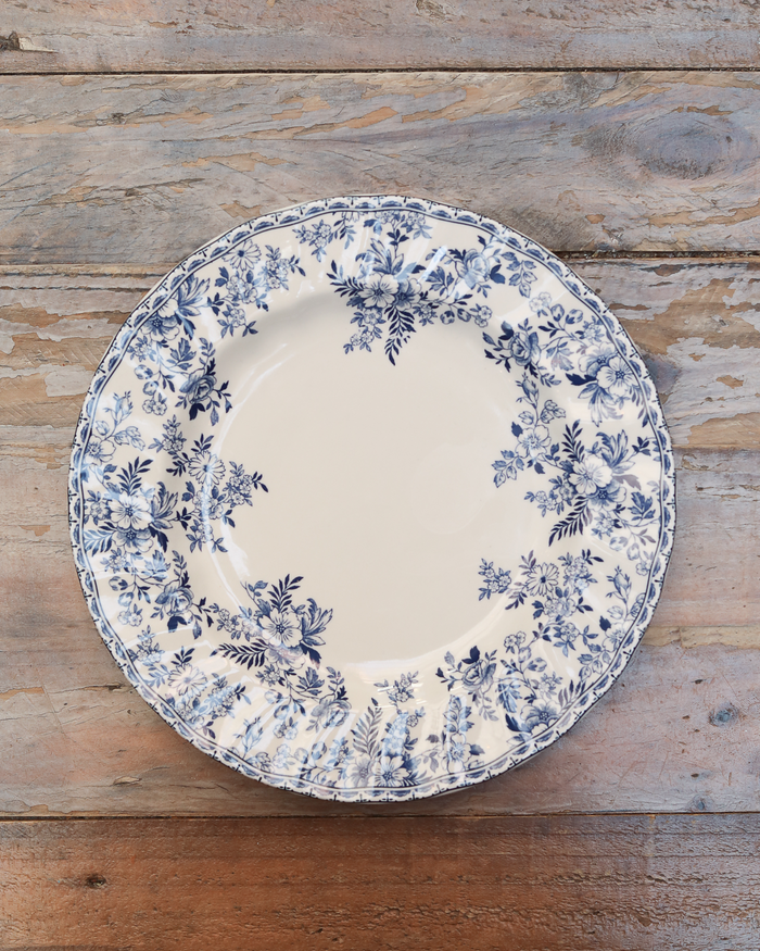 maman dinner plate — blue floral pattern on white background