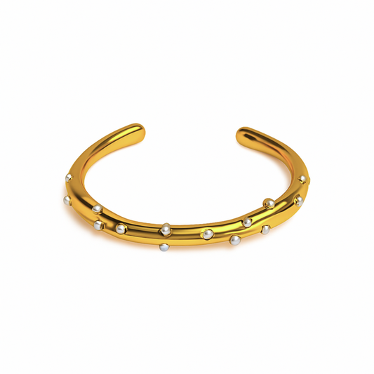 Gold open cuff bangle with small round pearls by Coconut Lane.