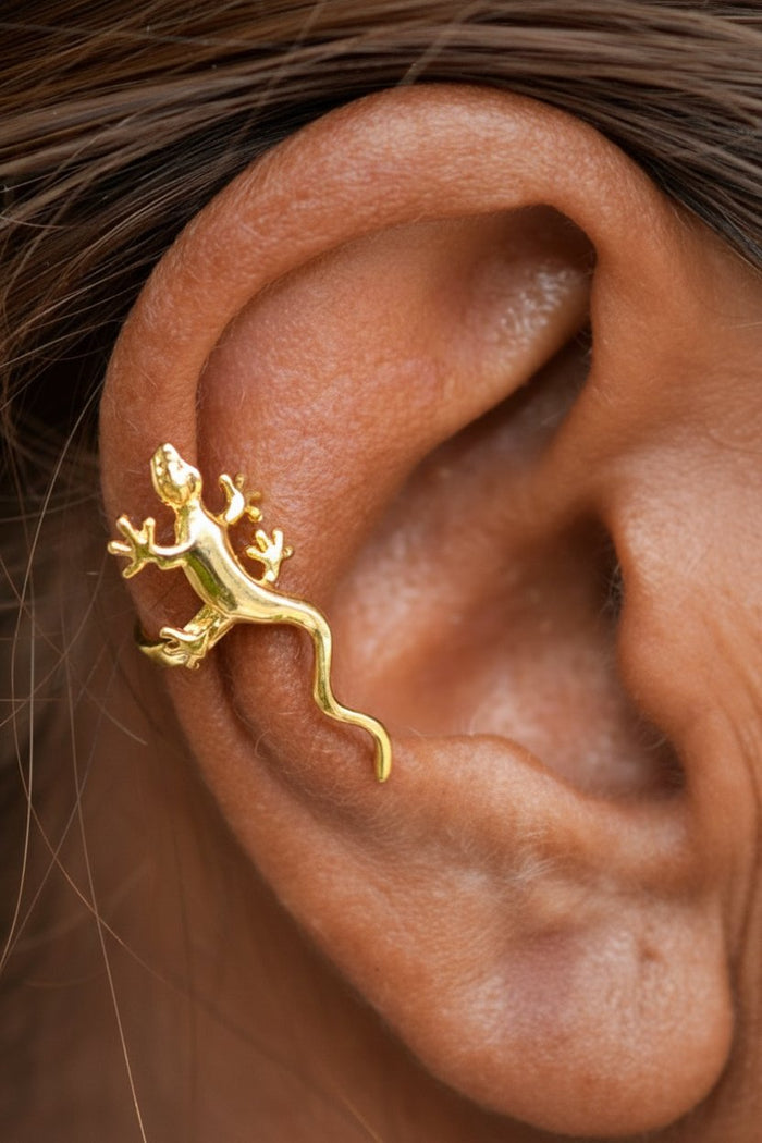 Gold gecko ear cuff, non-piercing animal ear jewelry, model wearing, close-up side view