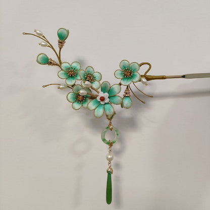 Handmade Ronghua turquoise plum blossom velvet flower hairpin with natural mulberry silk, gold wire, pearls, and green jade tassel