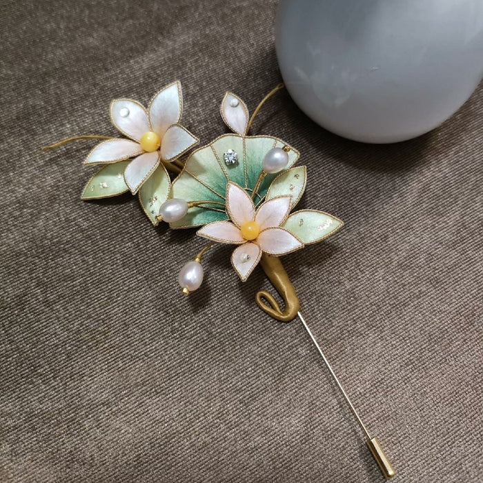 Handmade Ronghua white and pink silk velvet flower brooch with natural mulberry silk, green leaves, pearls, and crystal accents