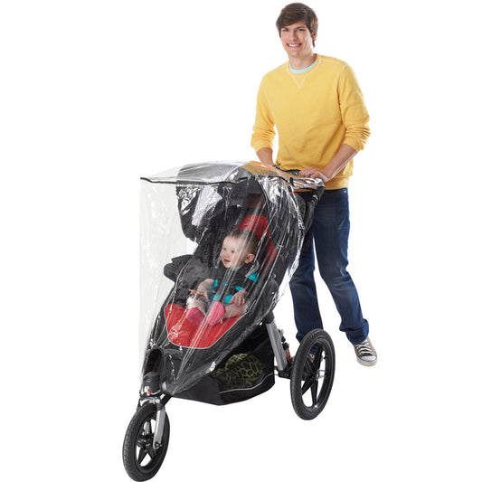 A man in a yellow sweater pushes a jogging stroller with a Jogging Stroller Weather Shield, keeping the smiling baby dry and protected as they hold onto the sides.