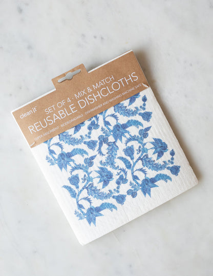 A pack of 4 reusable dishcloths with blue and white floral pattern.