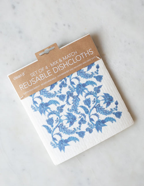 A pack of 4 reusable dishcloths with blue and white floral pattern.