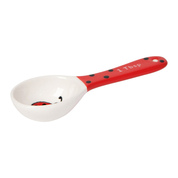 Ladybug measuring spoon on a white background