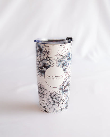 Stainless steel tumbler with blue and white flower pattern and the "maman" round logo.