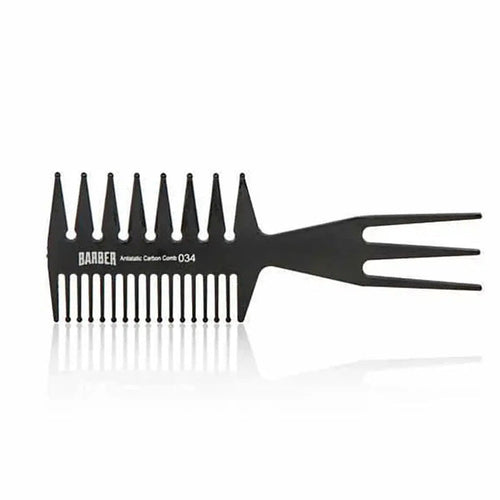 “Marmara BARBER Wide Tooth Comb Nº 034 held by a barber, showing its sturdy build”