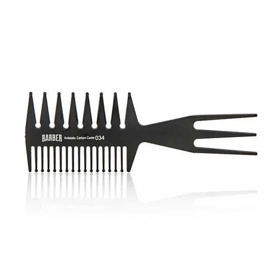 “Marmara BARBER Wide Tooth Comb Nº 034 held by a barber, showing its sturdy build”