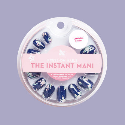 Micro Floral - Press-On | Short | Round navy false nails with small pastel floral print for a quick at-home mani