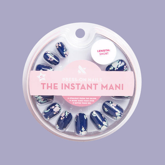 Micro Floral - Press-On | Short | Round navy false nails with small pastel floral print for a quick at-home mani