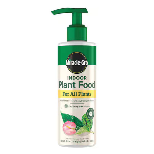 Miracle-Gro indoor plant food bottle on a white background
