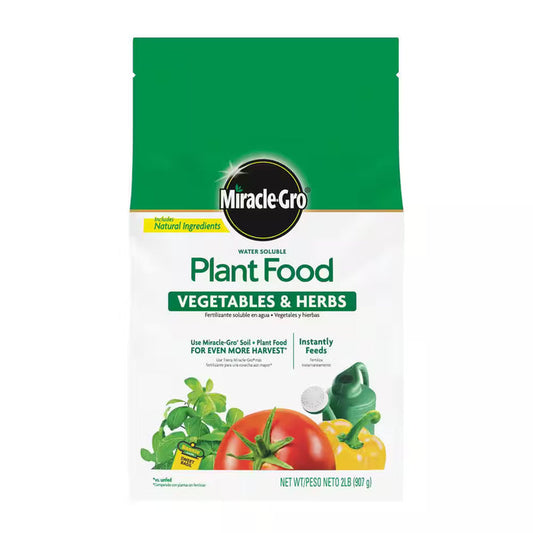 Bag of Miracle-Gro plant food for vegetables and herbs on a white background