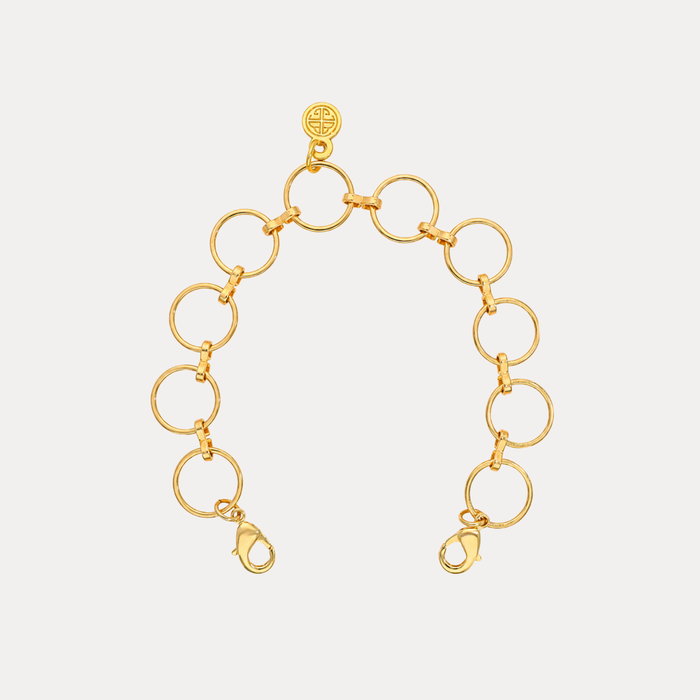 O-Ring Chain Bracelet featuring polished gold circular links and dual lobster clasps for a chic, architectural look.