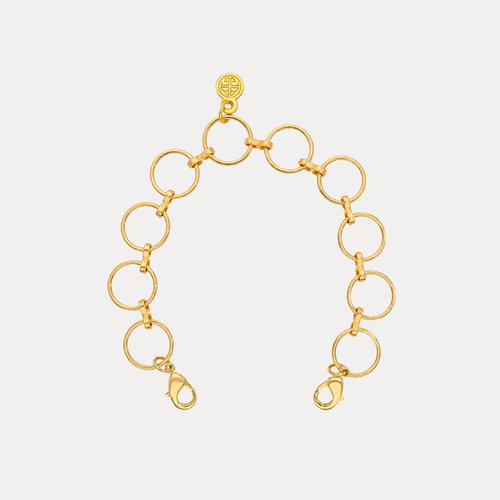 O-Ring Chain Bracelet featuring polished gold circular links and dual lobster clasps for a chic, architectural look.
