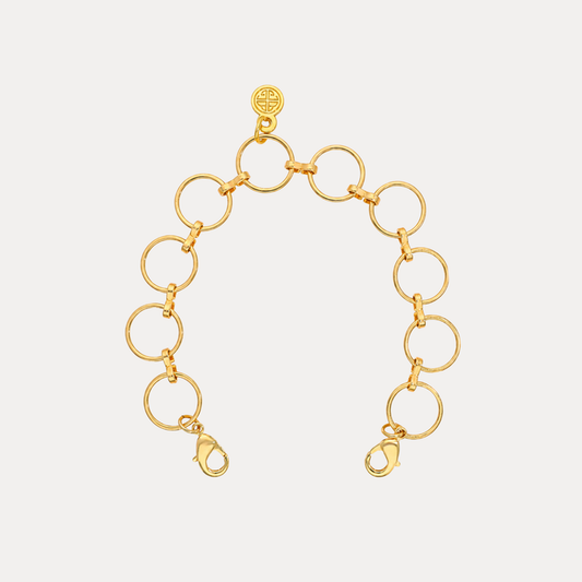 O-Ring Chain Bracelet featuring polished gold circular links and dual lobster clasps for a chic, architectural look.