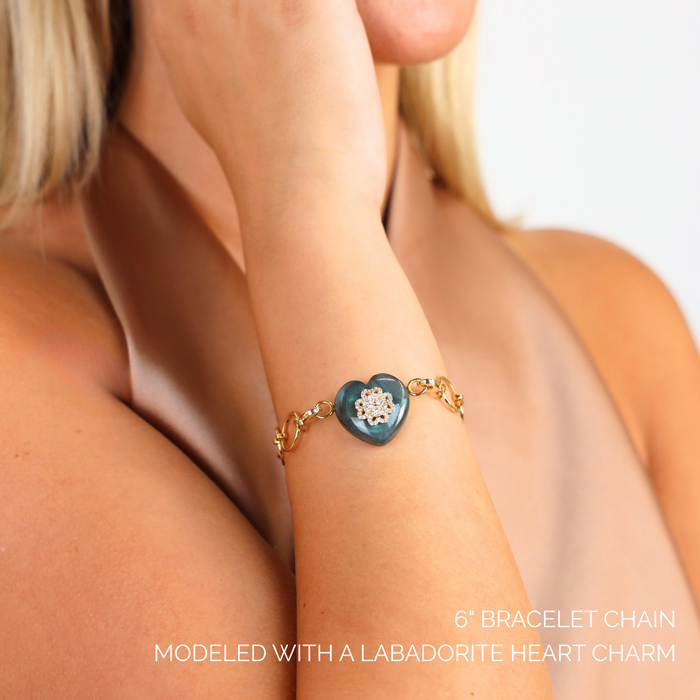 O-Ring Chain Bracelet displayed on a wrist, featuring a labradorite heart charm for added elegance.