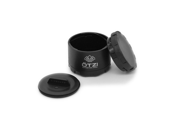 Black airtight storage container with removable lid and inner seal, shown open