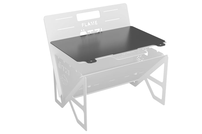 Black griddle plate accessory attached to a portable grill frame