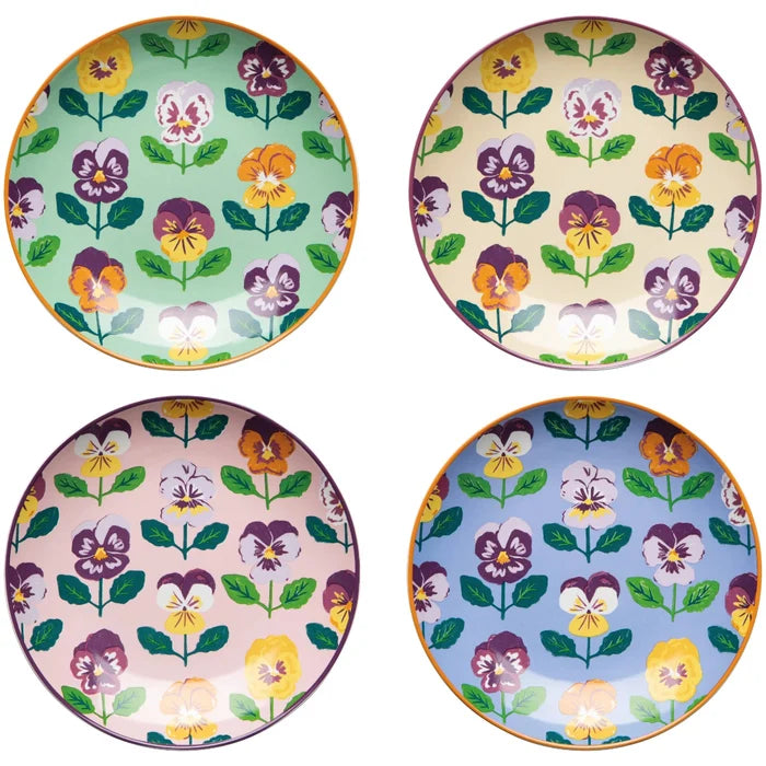 Four floral-patterned plates in different colors on a white background